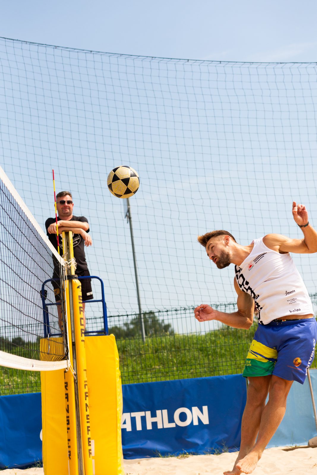 Footvolley player heading the ball
